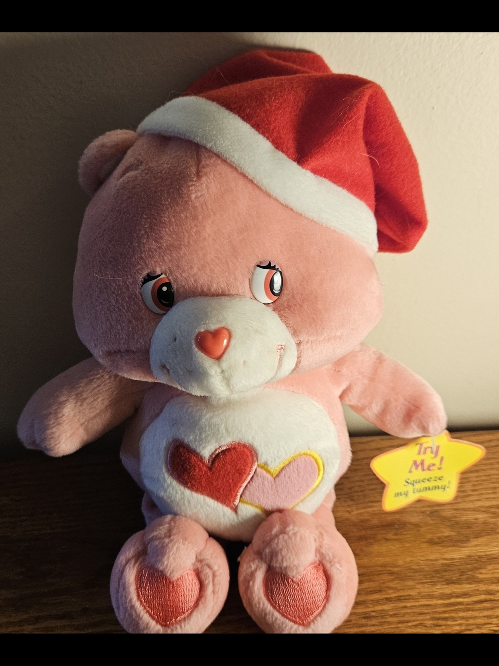 Love-A-Lot Care Bear Wearing A Red Santa Hat Singing Plush 10"